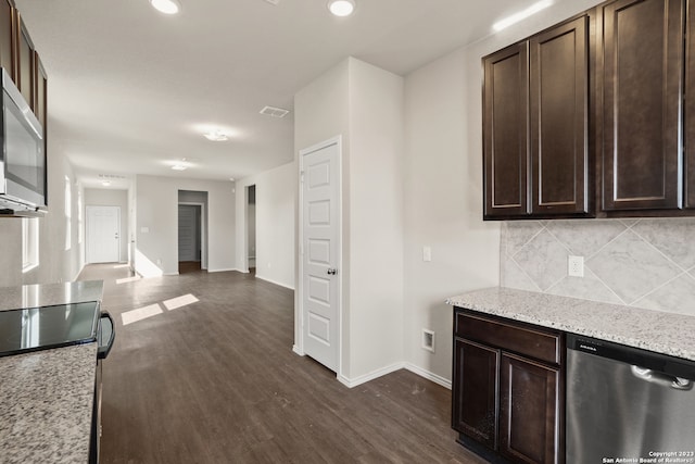 kitchen featuring dark brown cabinets, dark hardwood / wood-style floors, and stainless steel appliances