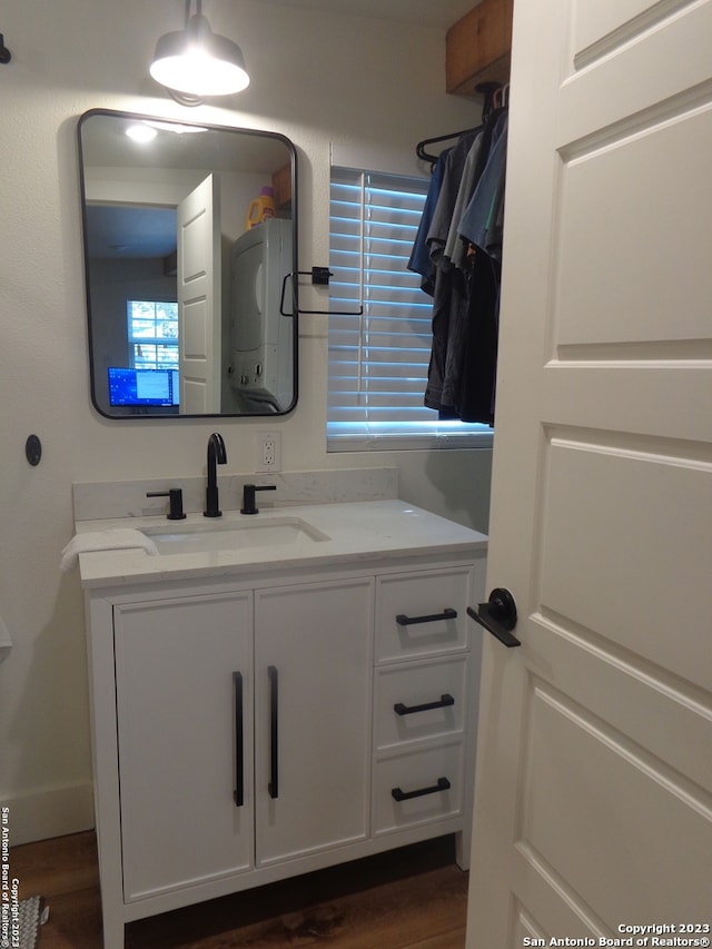 bathroom with hardwood / wood-style flooring and vanity