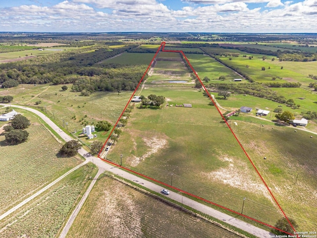 birds eye view of property with a rural view