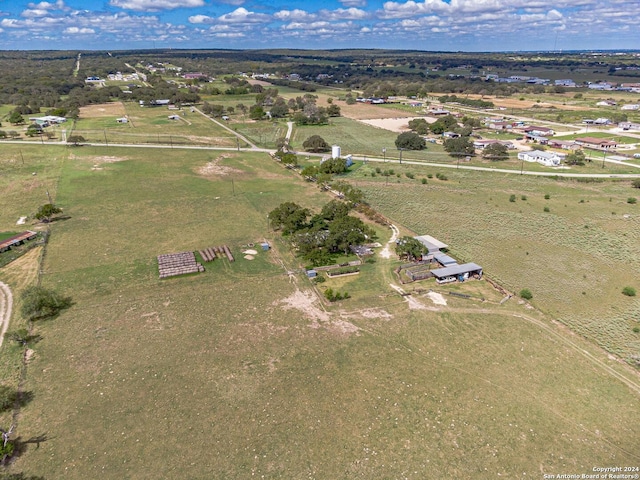 birds eye view of property with a rural view