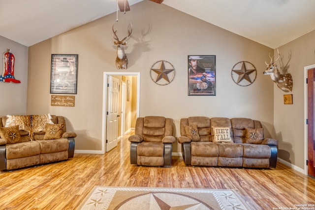 living room featuring vaulted ceiling, hardwood / wood-style floors, and ceiling fan