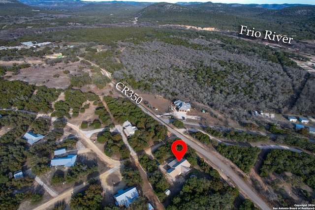 birds eye view of property featuring a mountain view