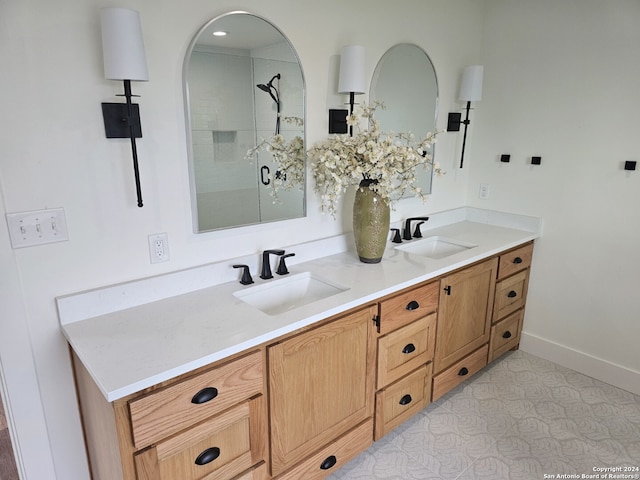 bathroom featuring vanity and a shower with door