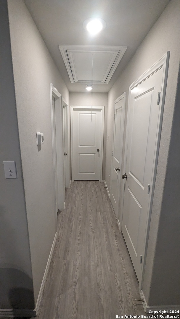 hallway featuring light hardwood / wood-style flooring