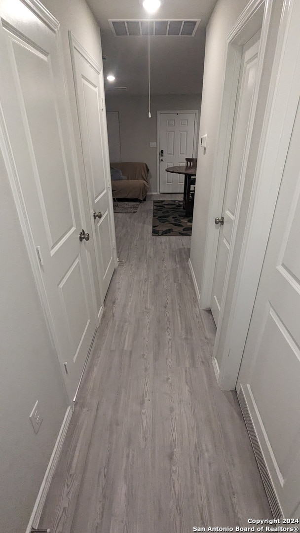 hall featuring light hardwood / wood-style flooring