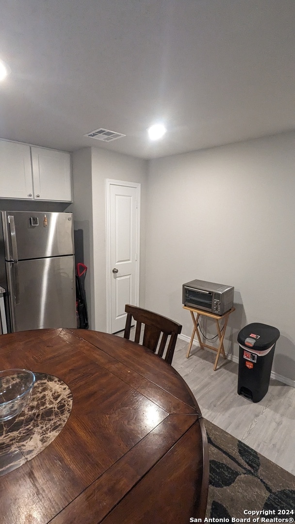 dining room with light hardwood / wood-style flooring