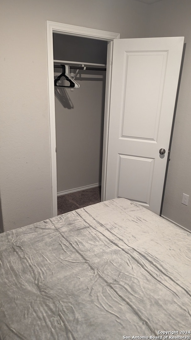 unfurnished bedroom featuring a closet