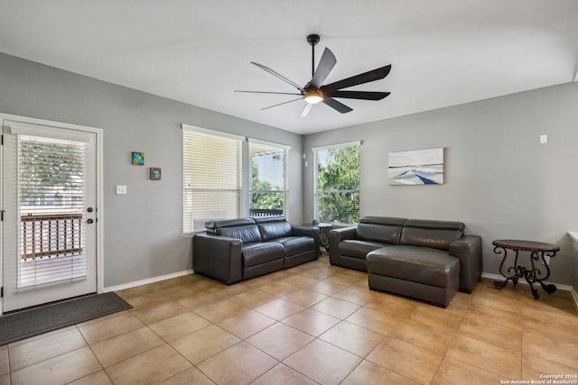 living room featuring ceiling fan and light tile patterned floors