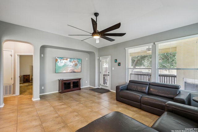 tiled living room featuring lofted ceiling and ceiling fan