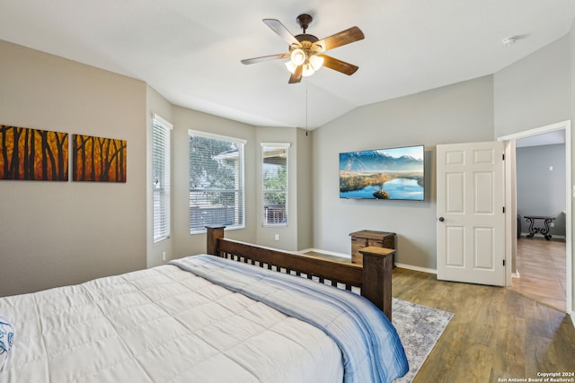 bedroom featuring vaulted ceiling, hardwood / wood-style floors, and ceiling fan