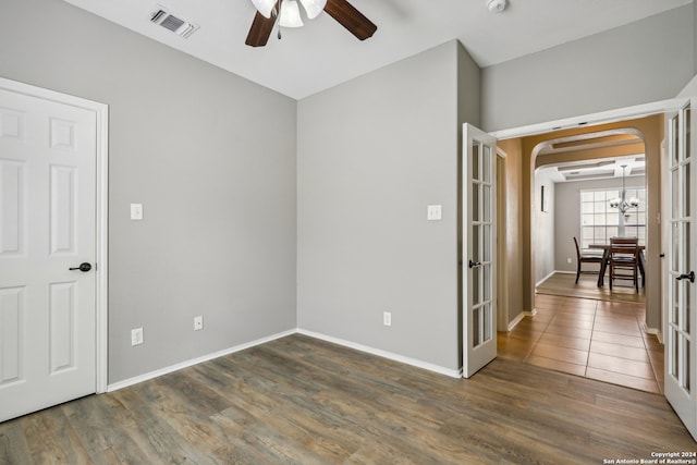 unfurnished room with ceiling fan and dark hardwood / wood-style floors