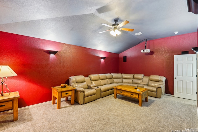 living room with ceiling fan, carpet floors, lofted ceiling, and a textured ceiling