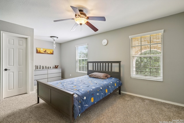 bedroom featuring ceiling fan and carpet floors