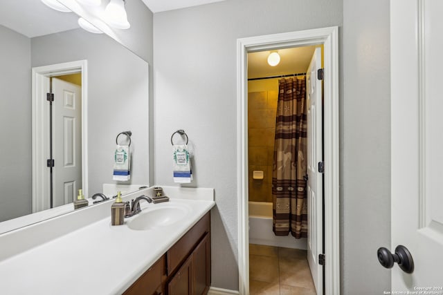 bathroom with shower / tub combo with curtain, tile patterned floors, and vanity