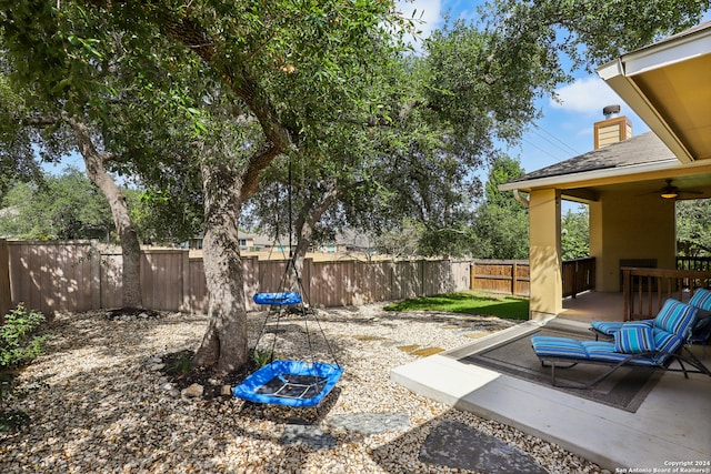 view of yard featuring a patio and ceiling fan