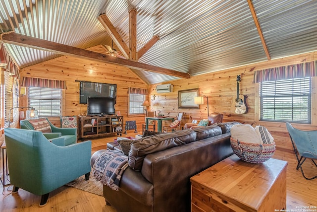 living room with lofted ceiling with beams, a wall unit AC, hardwood / wood-style flooring, wooden walls, and ceiling fan