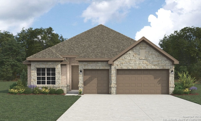 view of front of property featuring a front yard and a garage