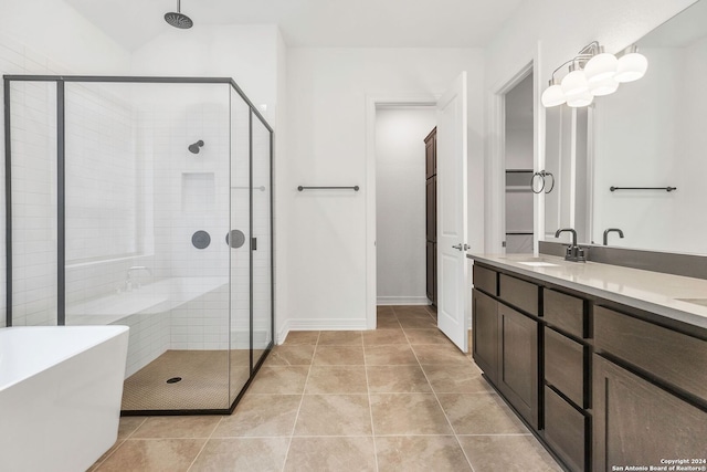 bathroom with separate shower and tub, tile patterned floors, and vanity