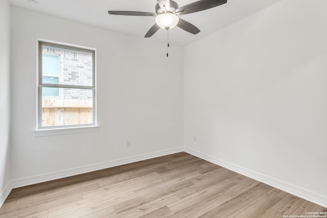 unfurnished room with ceiling fan and light wood-type flooring