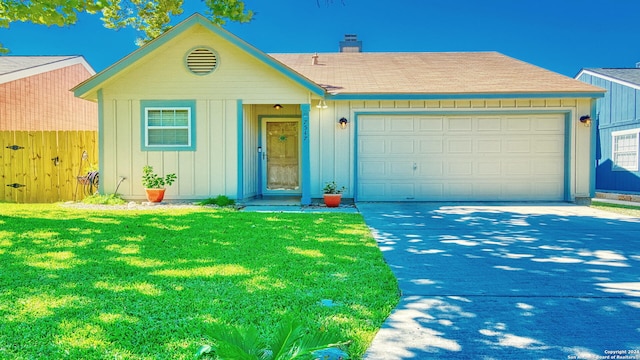 ranch-style home featuring a garage and a front lawn