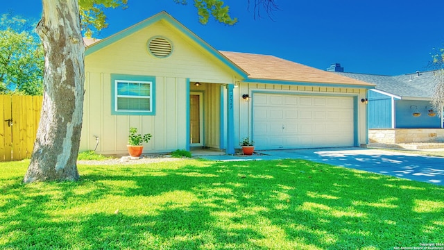 ranch-style house with a garage and a front yard