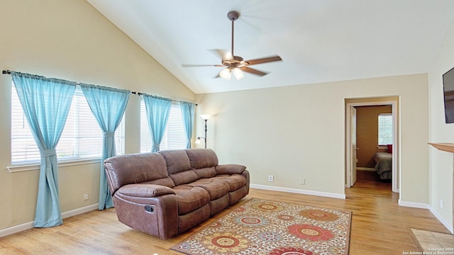 living room with light wood-type flooring, lofted ceiling, and ceiling fan