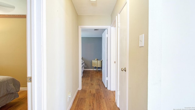 corridor featuring hardwood / wood-style floors