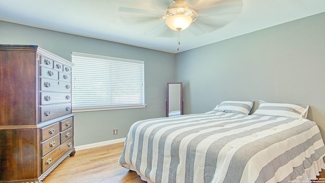 bedroom featuring light hardwood / wood-style flooring and ceiling fan