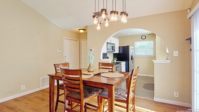 dining area with light hardwood / wood-style floors