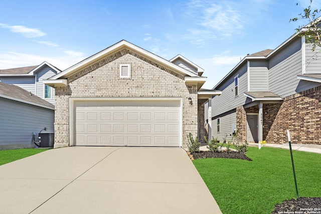 5103 Sandstone Way, San Antonio, TX 78222 - view of front of house featuring brick siding, driveway, a front lawn, and an attached garage