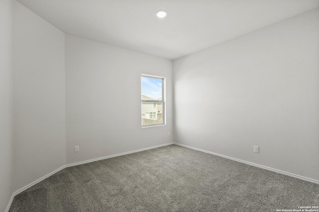 5103 Sandstone Way, San Antonio, TX 78222 - carpeted empty room with baseboards and recessed lighting