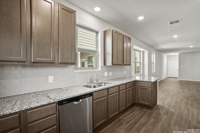 5103 Sandstone Way, San Antonio, TX 78222 - kitchen featuring dishwasher, backsplash, dark wood-style floors, a peninsula, and recessed lighting