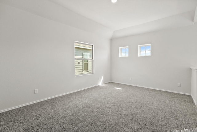 5103 Sandstone Way, San Antonio, TX 78222 - carpeted empty room featuring baseboards and vaulted ceiling
