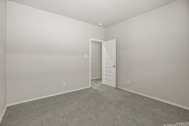 4951 Sandstone Way, San Antonio, TX 78222 - empty room featuring carpet flooring and baseboards