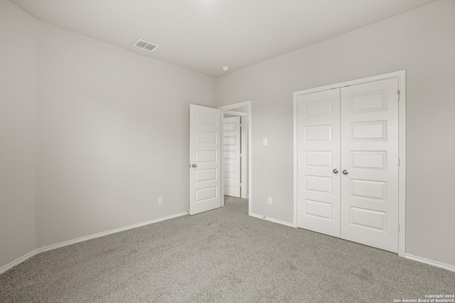 4951 Sandstone Way, San Antonio, TX 78222 - unfurnished bedroom featuring carpet floors and a closet