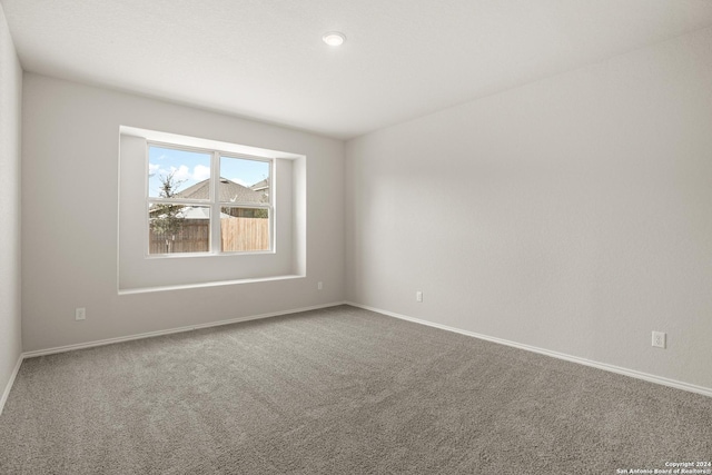 4951 Sandstone Way, San Antonio, TX 78222 - carpeted spare room with baseboards and recessed lighting