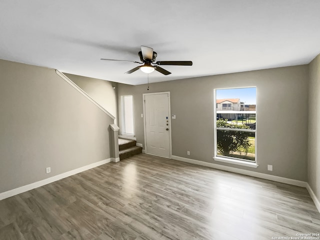 entryway with light hardwood / wood-style floors and ceiling fan