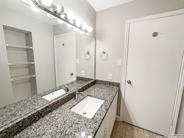 bathroom with tile patterned flooring and vanity