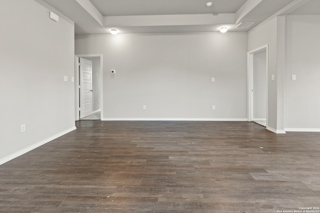 spare room featuring dark hardwood / wood-style flooring