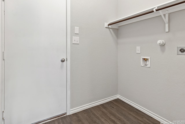 clothes washing area featuring electric dryer hookup, hookup for a washing machine, and dark hardwood / wood-style flooring