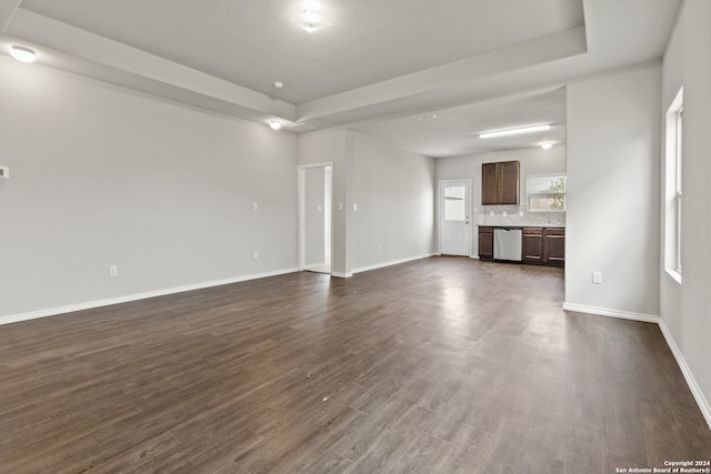 unfurnished living room featuring dark hardwood / wood-style flooring