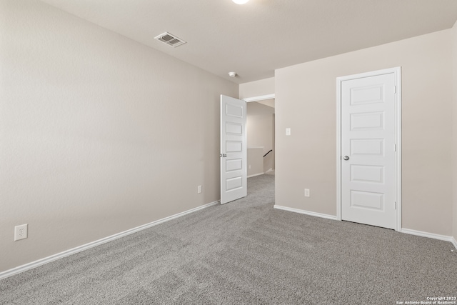 unfurnished room with carpet floors