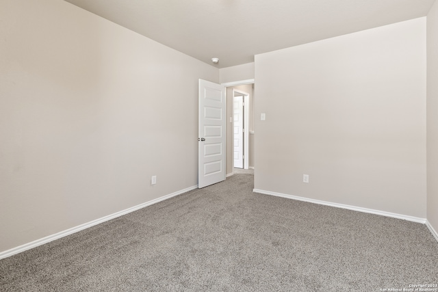 empty room featuring carpet flooring