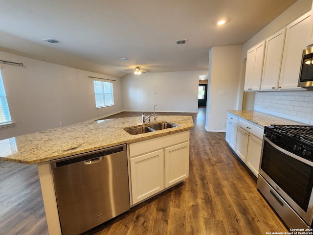 kitchen featuring white cabinets, a kitchen island with sink, stainless steel appliances, and sink