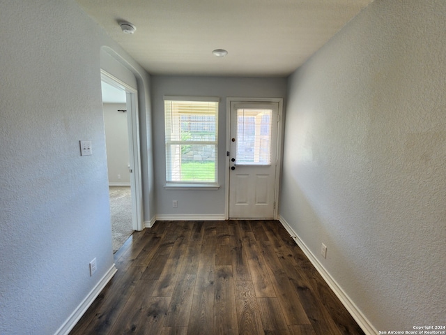 doorway to outside with dark hardwood / wood-style flooring