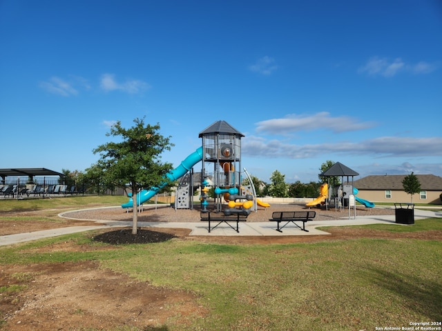 view of jungle gym with a lawn