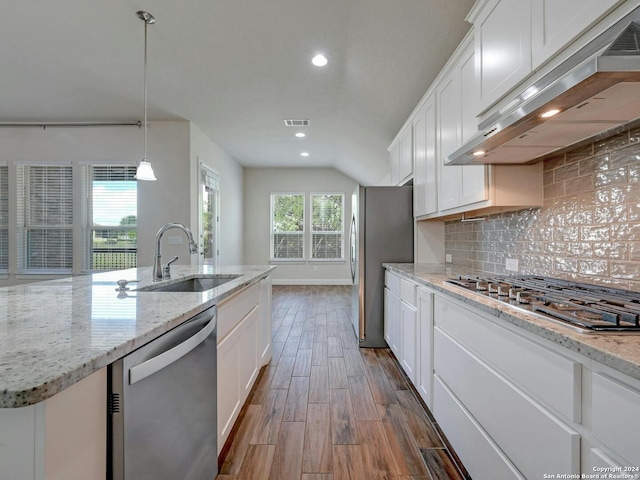 kitchen with sink, extractor fan, white cabinetry, stainless steel appliances, and dark hardwood / wood-style floors