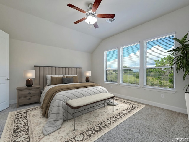 bedroom with carpet, vaulted ceiling, and ceiling fan