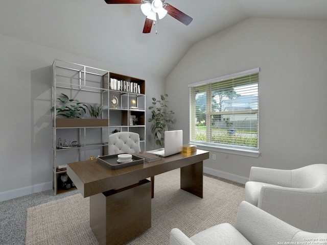 office space featuring vaulted ceiling, light carpet, and ceiling fan