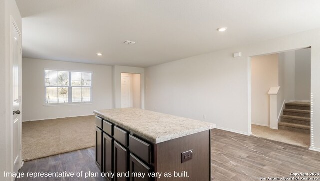 kitchen featuring light hardwood / wood-style flooring and a kitchen island